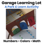 Homemade cardboard garage learning lot with numbered parking spaces and colorful doors for hands-on math, counting, and color activities.